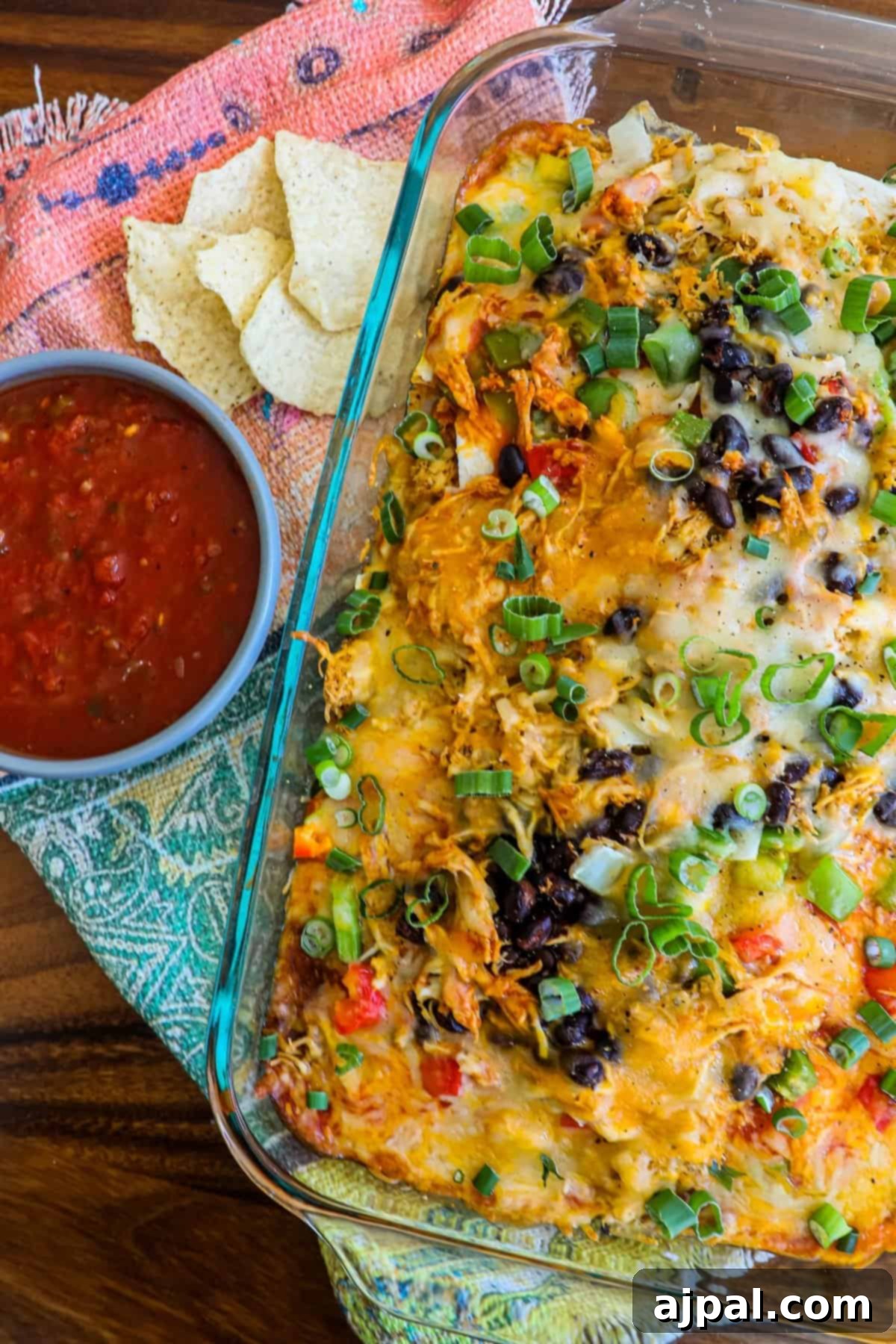 A close-up view of the bubbling, golden-brown cheese and perfectly baked layers of the Chicken Taco Casserole.