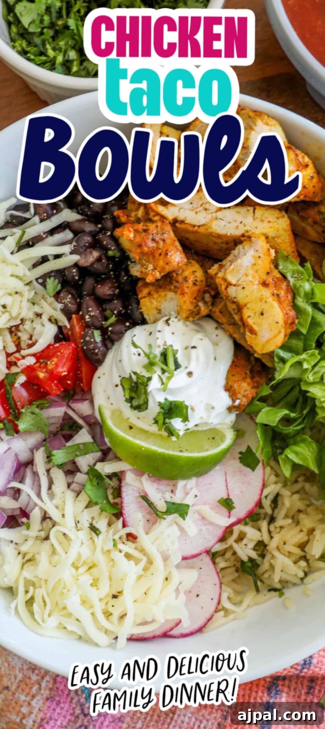 Flavorful Chicken Burrito Bowls 8 chicken, lettuce, black beans, tomatoes, lime, and sour cream in a bowl with radishes and cheese