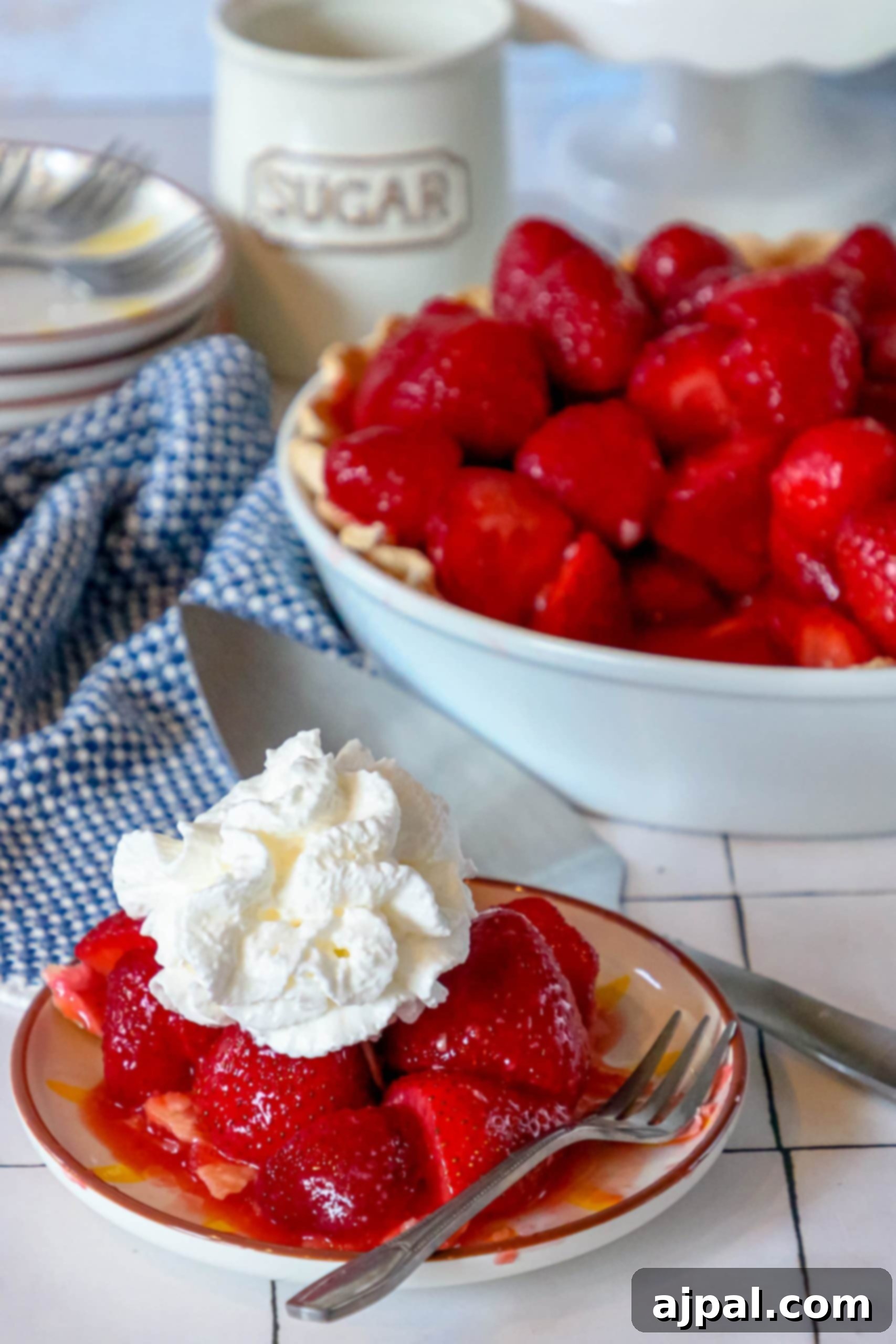 Sweet Summer Strawberry Pie 7 Easy strawberry pie with whipped cream on a plate, ready to be enjoyed.