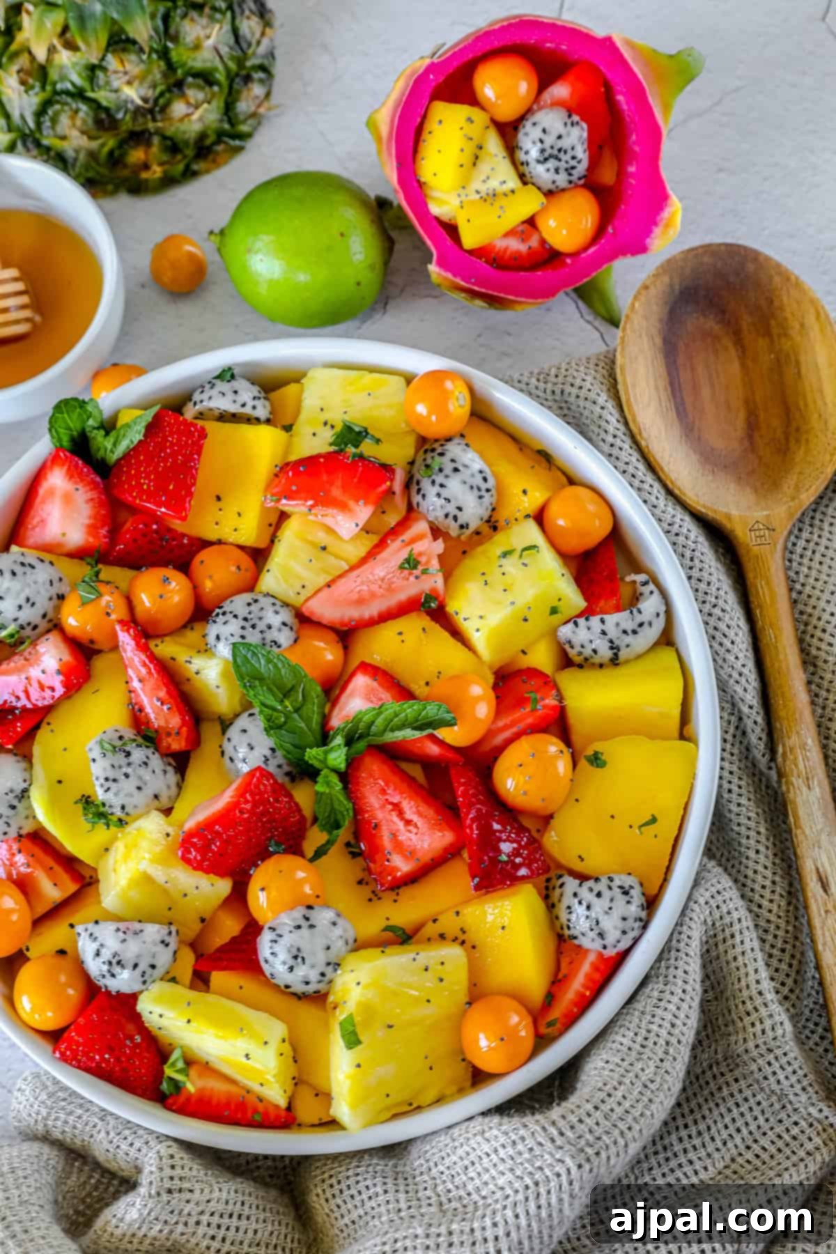 Paradise Fruit Medley 9 A beautifully arranged tropical fruit salad served in a natural coconut shell, highlighting its exotic appeal.
