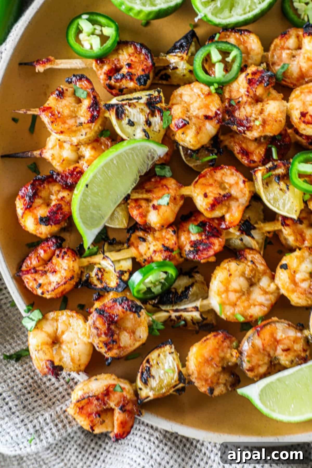 Zesty Margarita Grilled Shrimp 3 Raw extra jumbo shrimp in a bowl, ready to be marinated with fresh lime and spices.