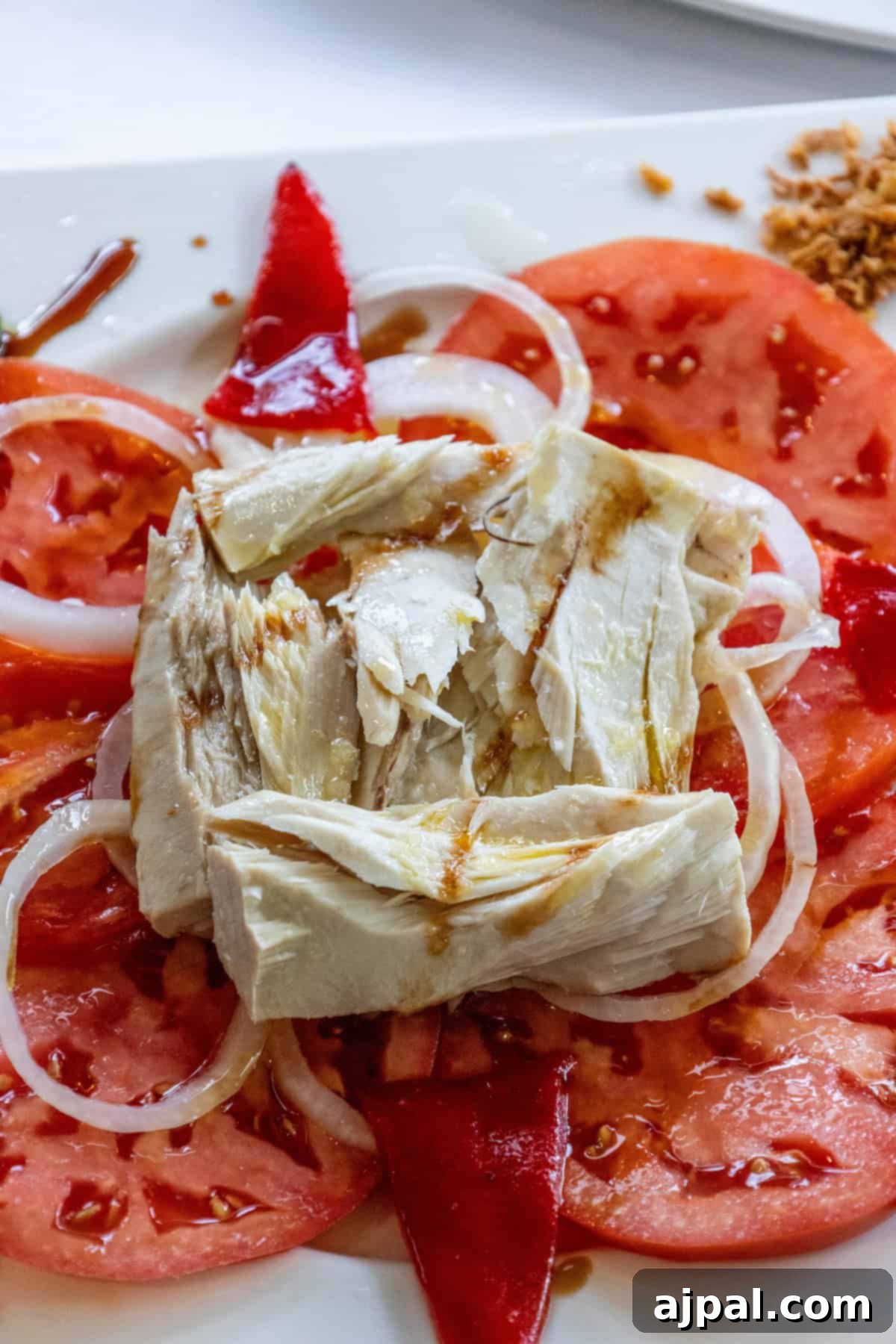 Zesty Tuna Tomato Bowl 4 A plate of local Basque cuisine, possibly leading to the discovery of the tuna and tomato salad.