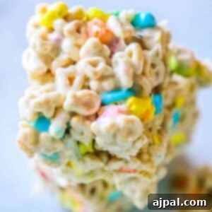 Stacked Lucky Charms cereal bars on a table.