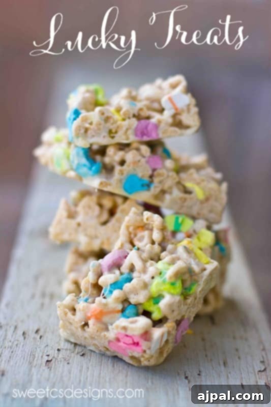 Rainbow Delights Homemade Lucky Charms Treats 3 Stacked Lucky Charms treats picture on a festive St. Patrick's Day background
