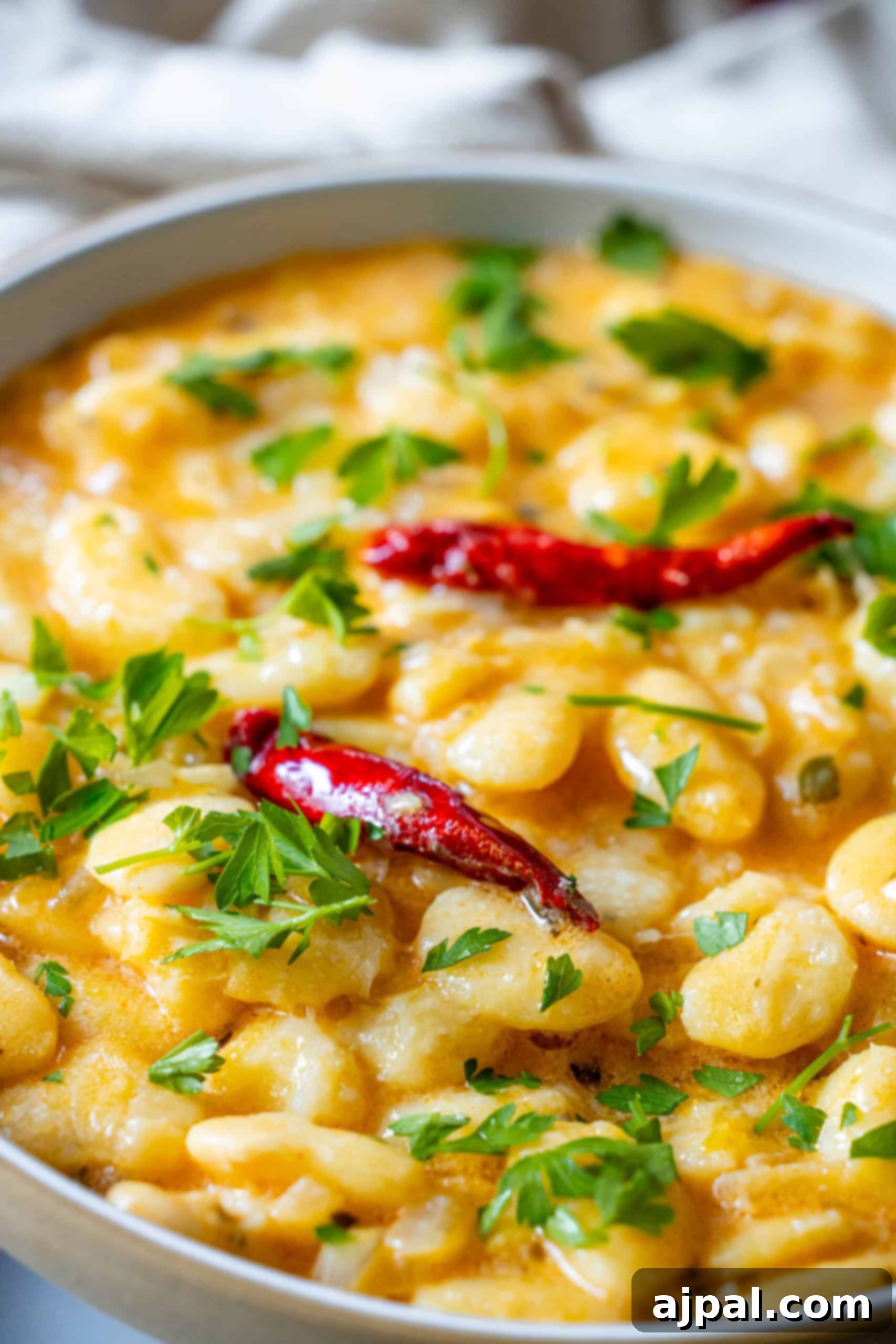 Velvety Garlic Butter Beans 9 A finished dish of creamy garlic chili butter beans, garnished and ready to serve.