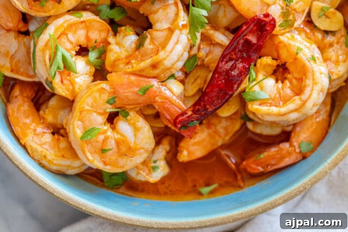 A wide shot of a delicious Gambas Pil Pil dish, showcasing its rich flavors and inviting presentation.