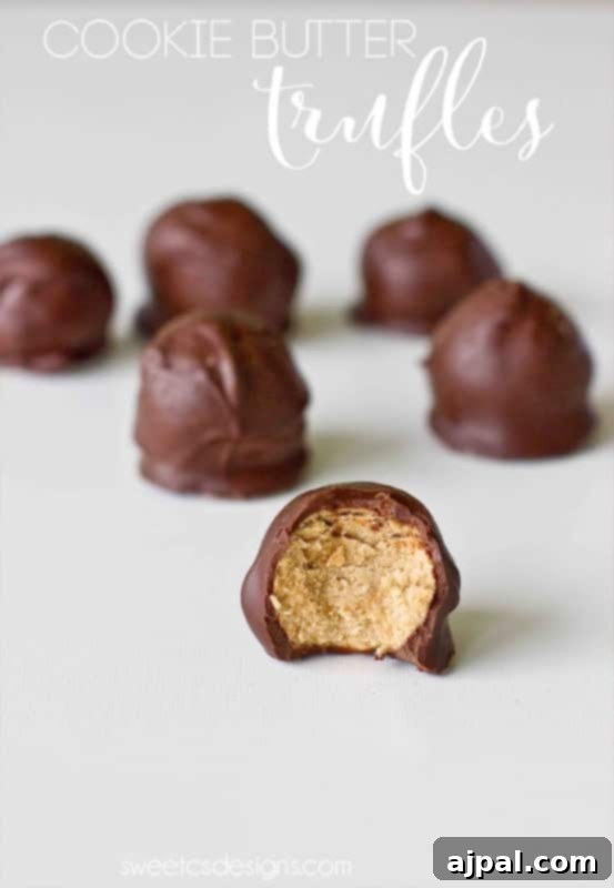 Cookie butter truffles with a bite taken out of them.