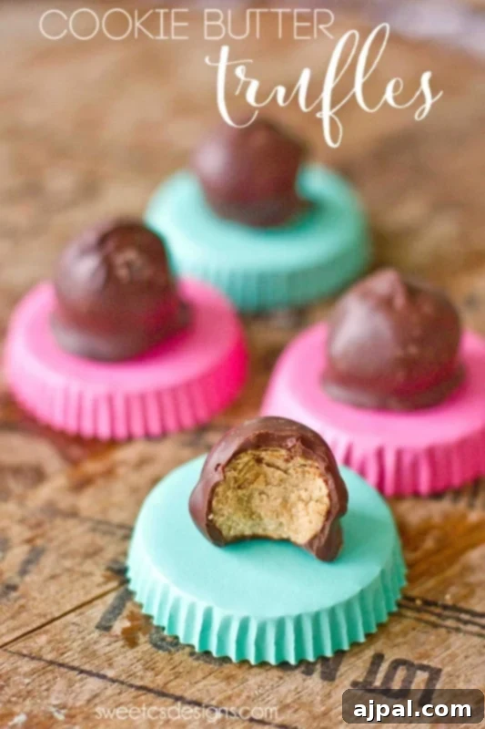 Cookie butter truffles on a wooden table.