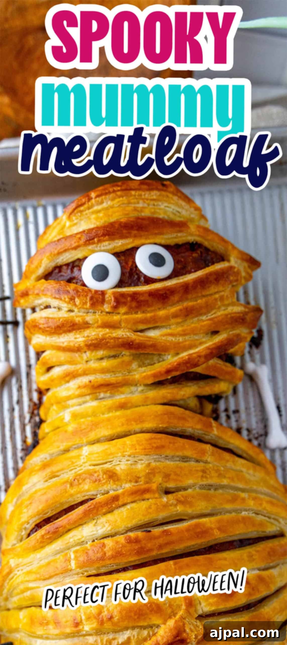A mummy-shaped meatloaf wrapped in pastry with eyes peeking through, labeled "Spooky Mummy Meatloaf" and "Perfect for Halloween!" as the ultimate treat for spooky celebrations.