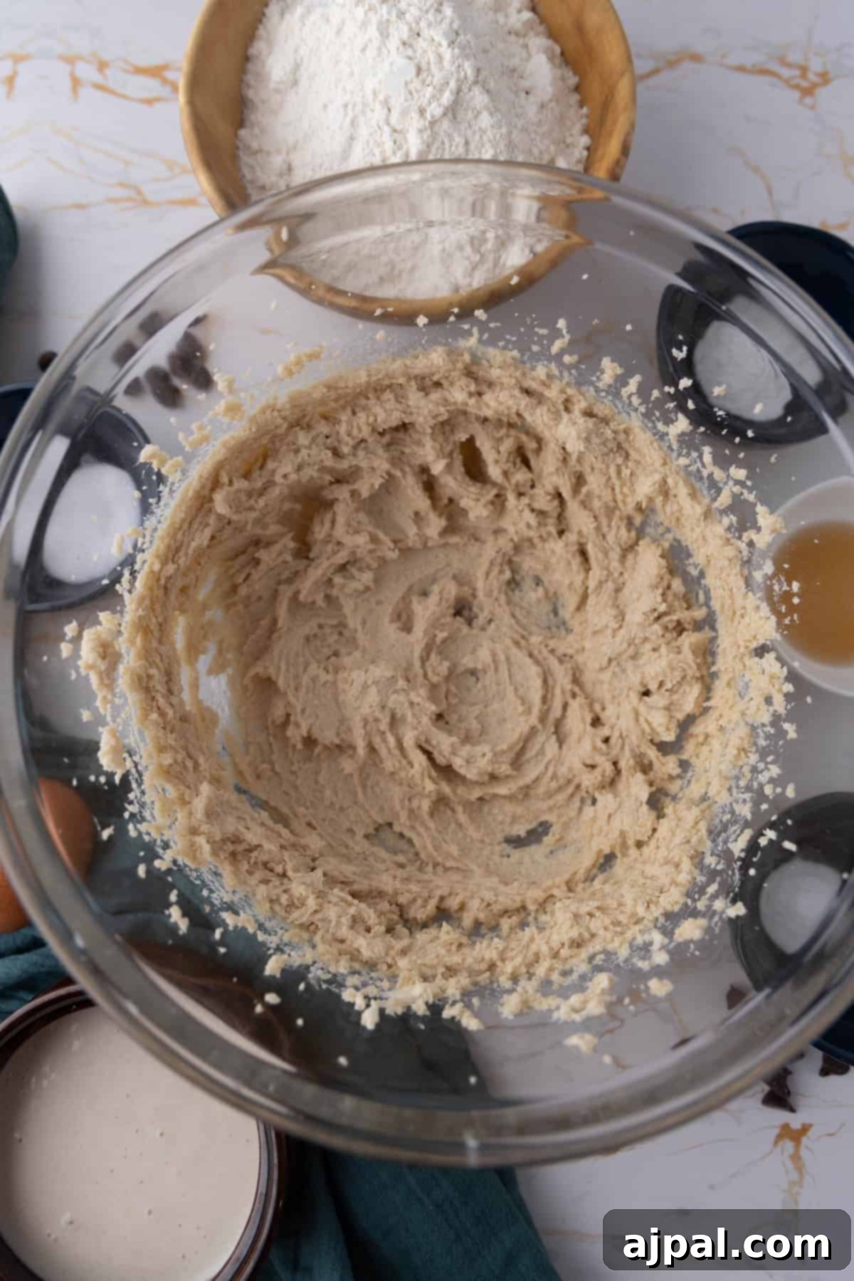 Next-Level Sourdough Discard Chocolate Chip Cookies 8 Mixing cookie dough in a glass bowl.
