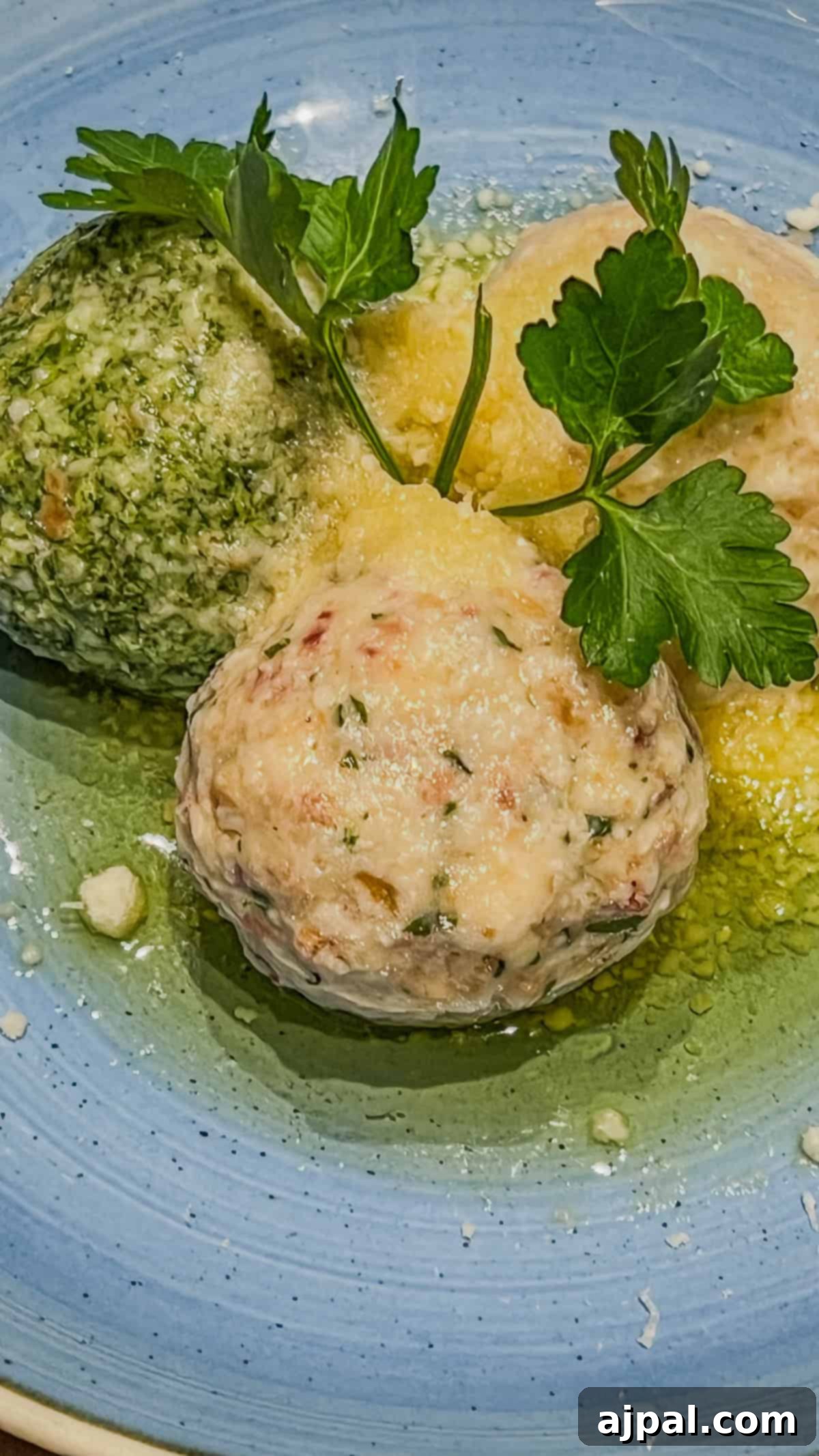 Bolzano's Magical Christmas Market 12 Three herb dumplings on a blue plate, garnished with parsley and set in a light buttery sauce, evoke the cozy warmth of Bolzano's Christmas Market.