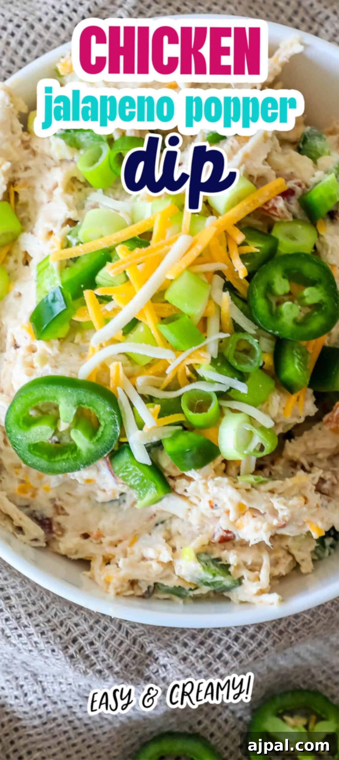 Ultimate Chicken Jalapeno Popper Dip 10 Bowl of chicken jalapeño popper dip topped with sliced jalapeños, green onions, and shredded cheese. Text reads: "Chicken jalapeno popper dip" and "Easy & Creamy!.