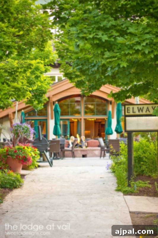 Parents' Vail Escape 3 The charming exterior of The Lodge at Vail, featuring a restaurant in a beautiful wooded setting, ideal for a serene and luxurious parents’ getaway.