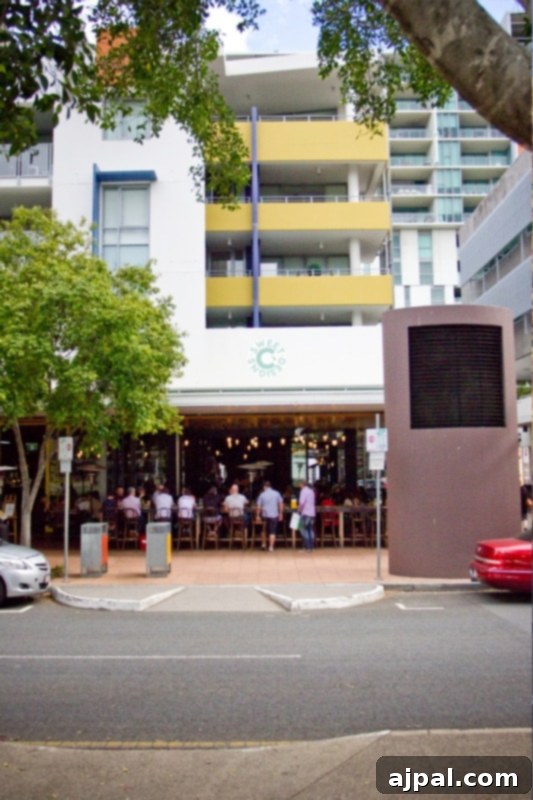 Experience Brisbane Australia 4 Vibrant South Bank Parklands in Brisbane, with diverse restaurants spilling out onto lively walkways, creating a beautiful and energetic atmosphere for visitors.