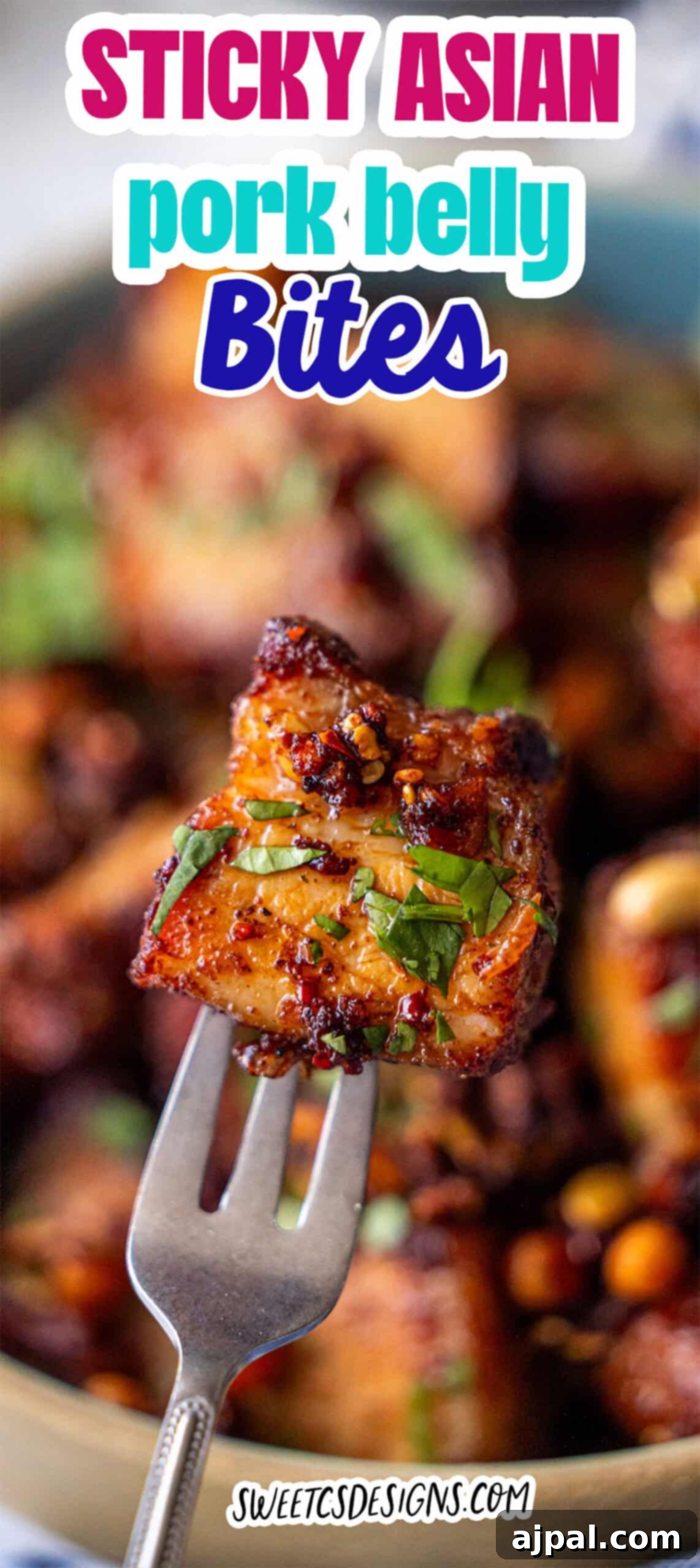 Glazed Asian Pork Belly Morsels 11 A fork holds a piece of glazed, sticky pork belly bites garnished with herbs, with more pieces blurred in the background. Text reads: "Sticky Asian pork belly bites.