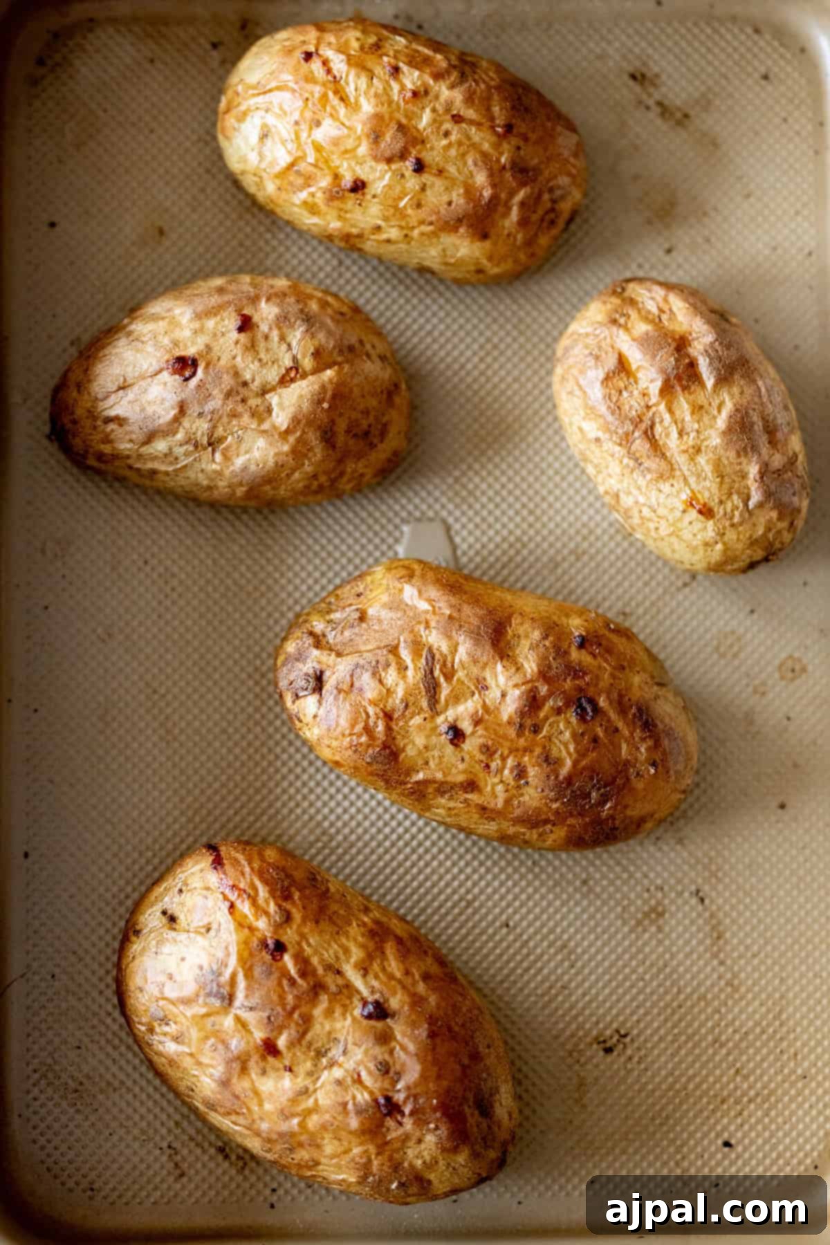 The Ultimate Double-Baked Potato 6 Five beautifully baked Russet potatoes with golden, crisp skins, ready to be transformed into Loaded Twice Baked Potatoes or enjoyed as a classic side.