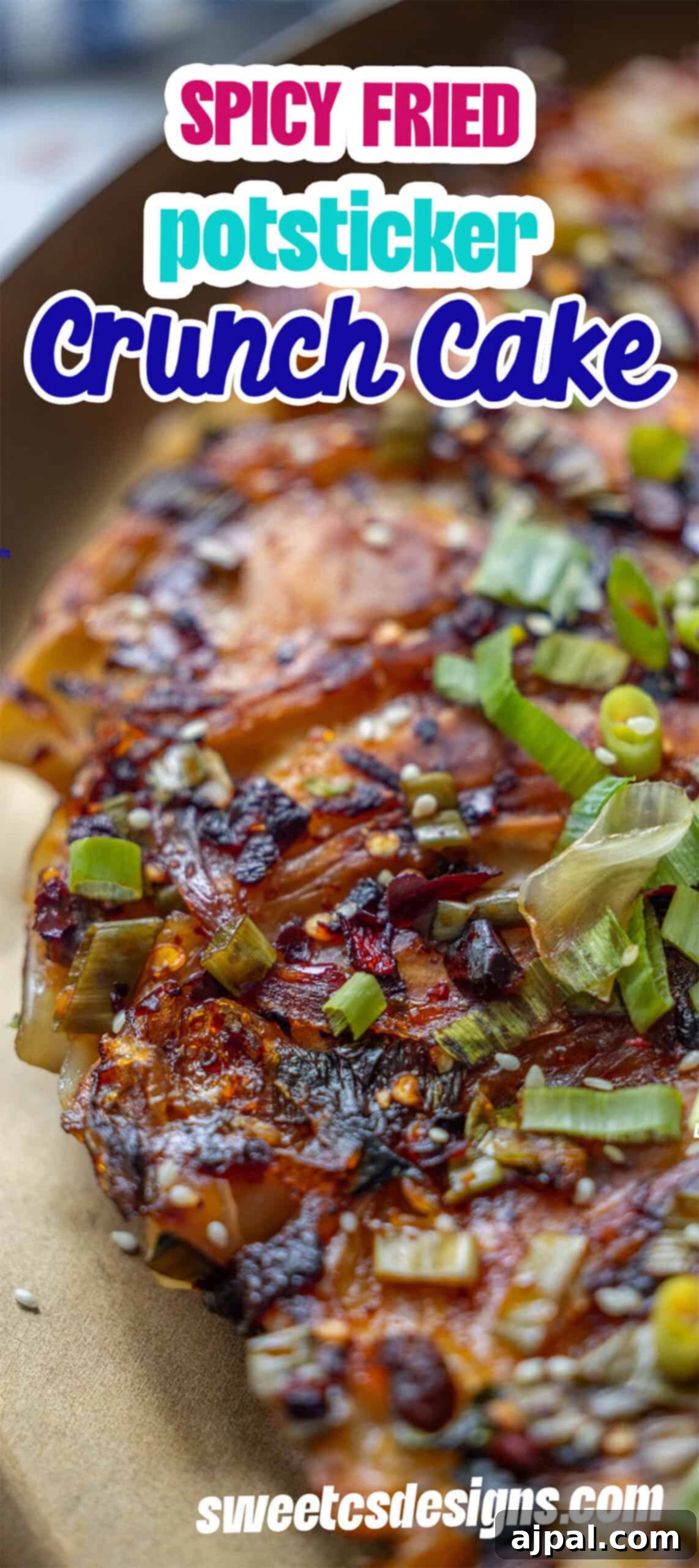 Spicy Potsticker Crunch Torte 13 Close-up of a crispy, pan-fried potsticker crunch cake topped with chopped green onions and sesame seeds—a perfect fried crunchy potsticker pancake for savory snacking.