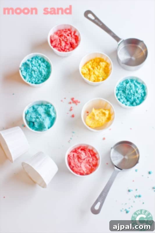 Homemade Gluten-Free Moon Sand 2 Three containers of blue, yellow, and red moon sand, ready for play, demonstrating vibrant colors and soft texture.