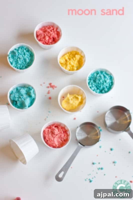 Homemade Gluten-Free Moon Sand 3 Bowls of blue, yellow, and red gluten-free moon sand with measuring spoons, illustrating the vibrant colors and sensory appeal.