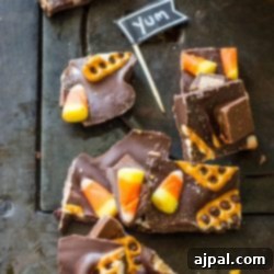 A table covered in Halloween Bark, a mixture of chocolate and candy bars.
