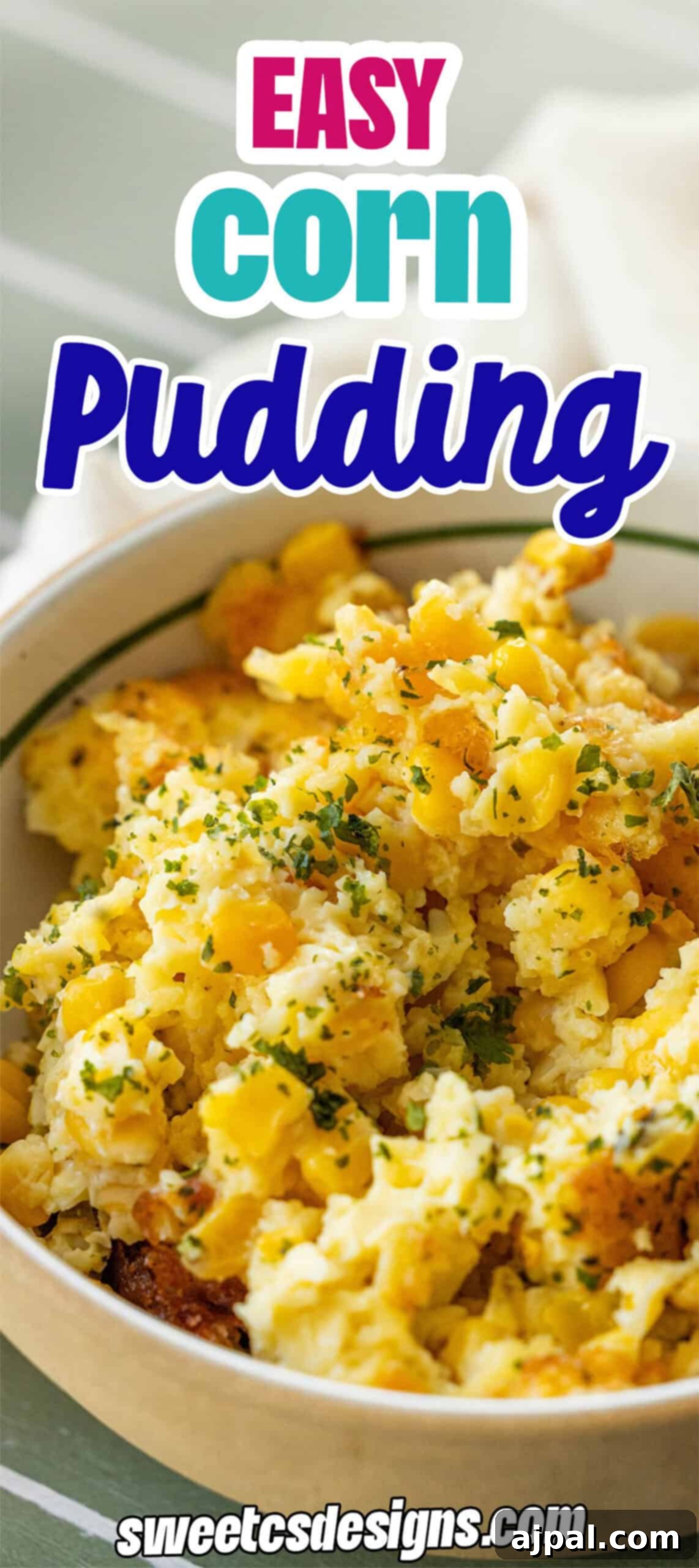 A mouthwatering bowl of easy, creamy corn pudding, beautifully garnished with fresh green herbs, making it an irresistible holiday side dish. Text on image reads: "Easy Corn Pudding" and "sweetcsdesigns.com".