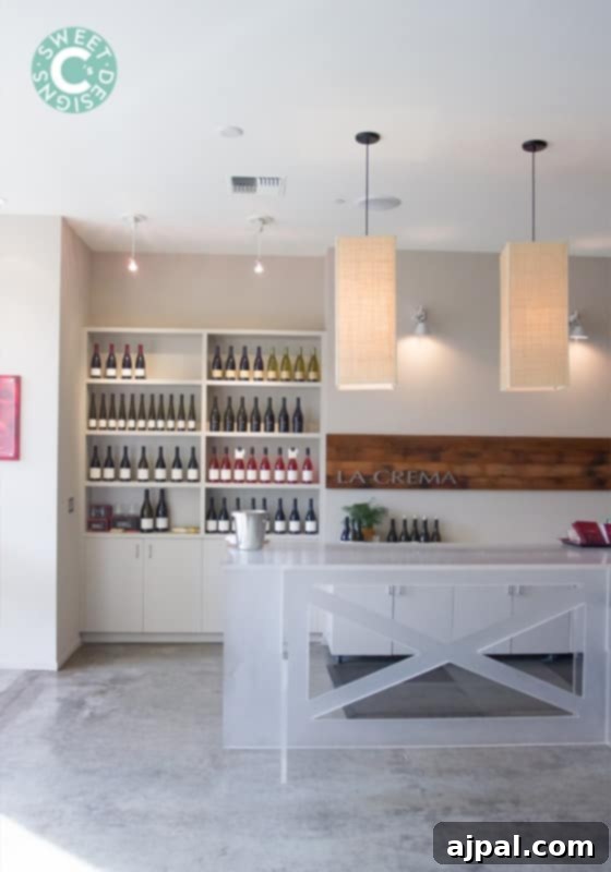 Interior view of La Crema Healdsburg Tasting Room featuring a wine bar stocked with bottles, showcasing modern design
