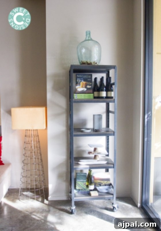 Stylish metal shelving unit adorned with La Crema wine bottles and decor in the tasting room