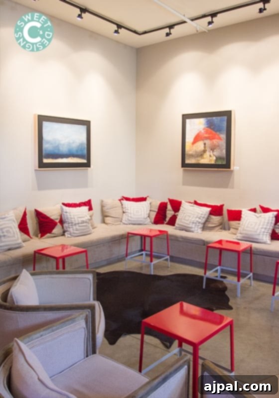 Cozy seating area with artwork and coffee in La Crema Healdsburg Tasting Room, inviting relaxation