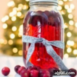 Cranberry-infused moonshine in a mason jar.