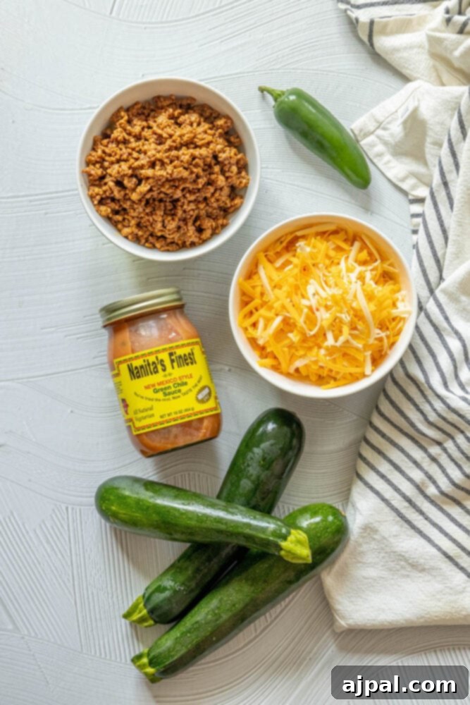 Baked Zucchini Treasures 5 Jalapeño, zucchinis, green chile enchilada sauce, ground beef taco mixture, shredded cheese on a table