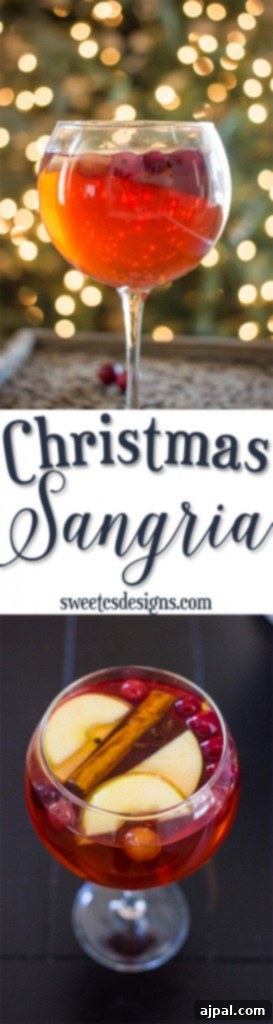 Christmas Sangria in a glass with a Christmas tree in the background, exuding a delicious festive feel.