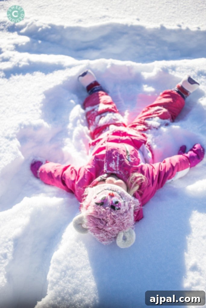 Avon Colorado Alpine Escape 9 A little girl, bundled in winter gear, happily sledding through the snowy landscapes of Avon and Beaver Creek, Colorado.