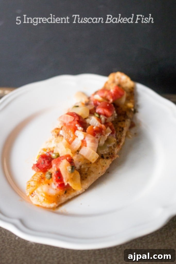 Beautifully baked Tuscan fish, ready to be served, a testament to quick and easy family cooking.