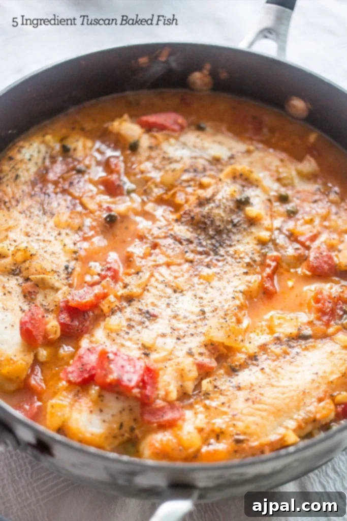 A vibrant Tuscan baked fish recipe featuring a skillet filled with rich tomato sauce, capers, and herbs, ready for the fish.