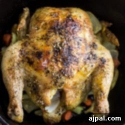 A Thyme Roast Chicken cooked in a cast iron skillet.