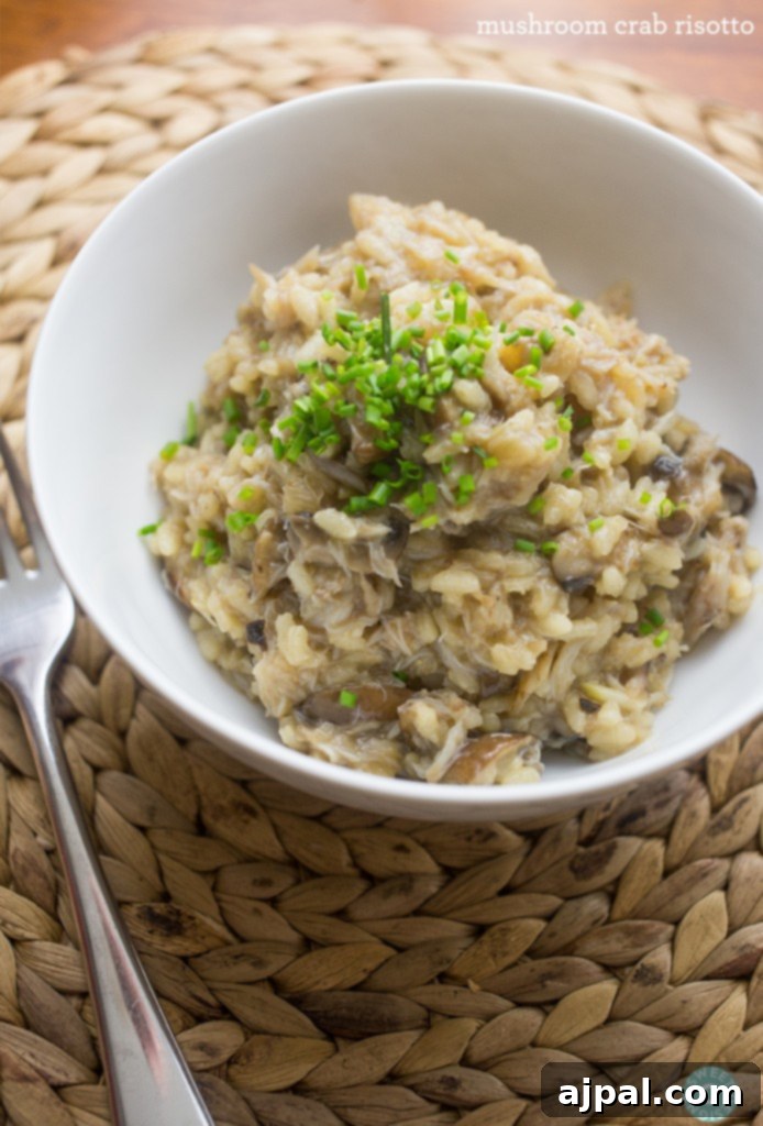 Creamy Mushroom and Crab Risotto 2 risotto in a bowl with green onions on top, showcasing a creamy texture and fresh garnish.