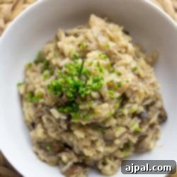 Creamy Mushroom and Crab Risotto 6 Mushroom risotto in a white bowl with crab.
