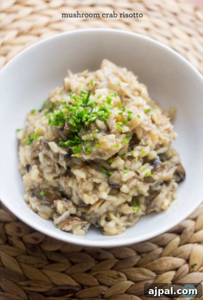 Creamy Mushroom and Crab Risotto 3 A close-up of creamy risotto in a bowl, garnished with fresh green onions, ready to serve.
