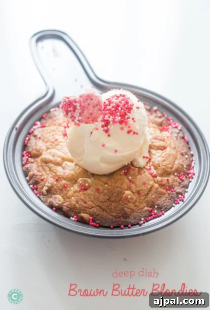 Irresistible Deep Dish Brown Butter Blondies, rich with browned butter, served fresh from the skillet.