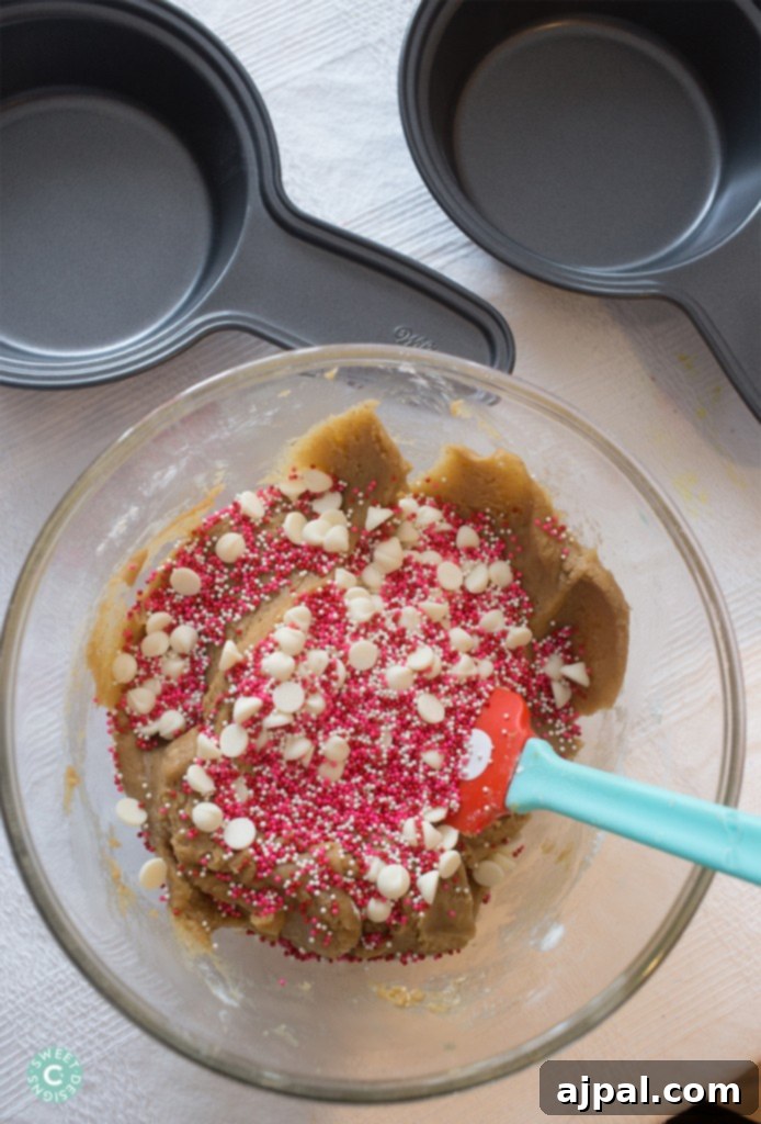 Wilton deep dish treat pans and a selection of colorful sprinkles, ready for baking.