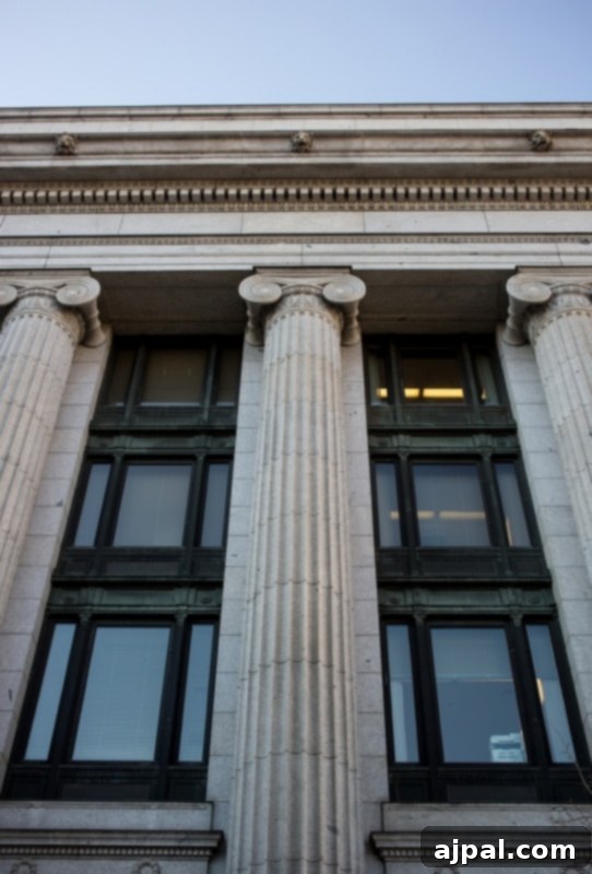 The grand facade of a Temple Square building, adorned with classical columns and arched windows