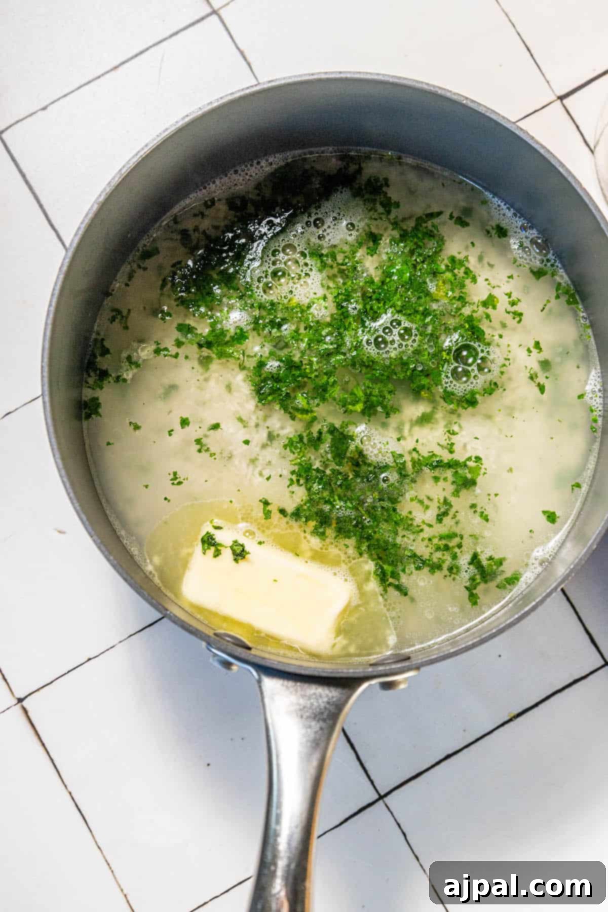 Zesty Chipotle Lime Rice 6 A frying pan with herbs in it.