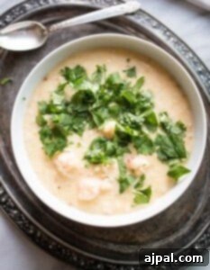 Gourmet Langoustine Grits 4 A bowl of langoustine soup with grits.