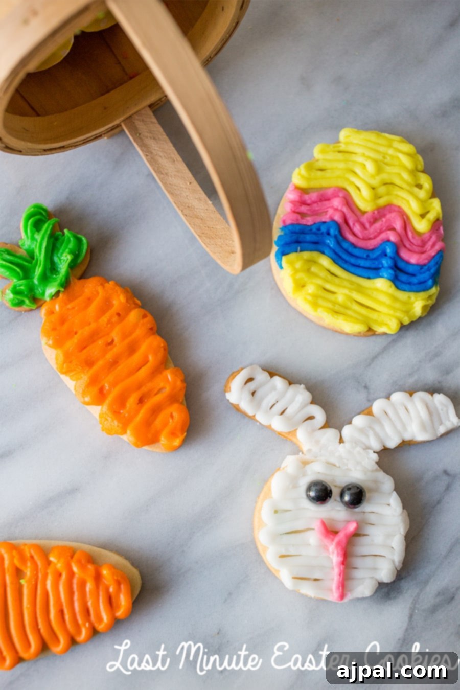 Simple Easter Egg Cookie Delights 2 Beautifully decorated sugar cookies shaped like an Easter egg, a cheerful carrot, and a cute bunny, arranged artfully on a surface.