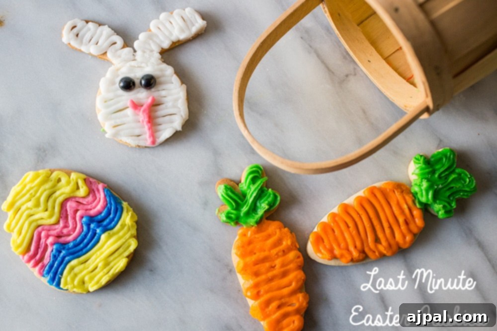 Simple Easter Egg Cookie Delights 3 Decorated sugar cookies in the shapes of an Easter egg, a carrot, and a rabbit face, with a festive Easter basket visible in the blurred background.