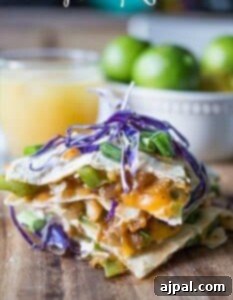 Cheesy shrimp quesadillas on a cutting board, an easy shrimp quesadilla appetizer.