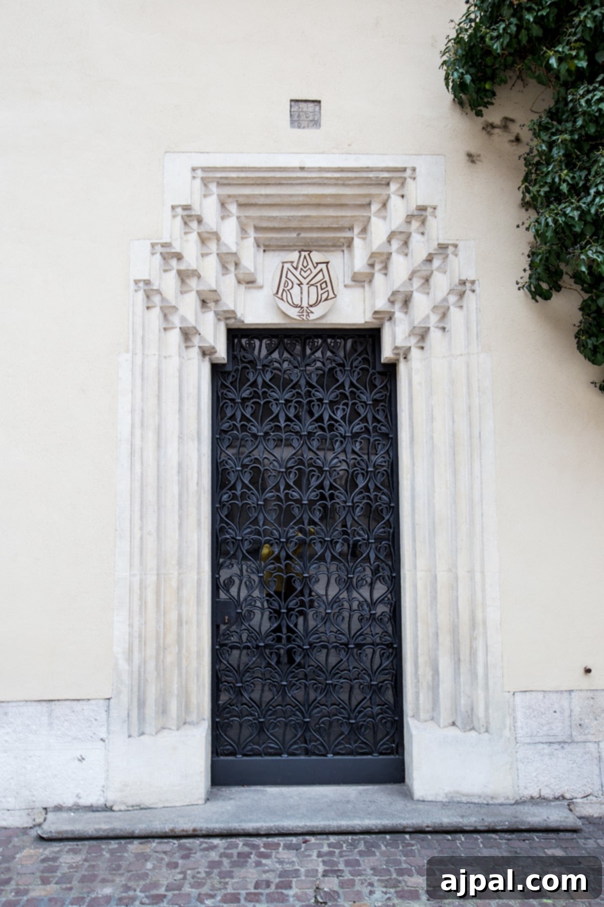Discovering Krakow's Wawel Castle and Cathedral 14 Elegant black door on a historic building within the Wawel Castle Courtyard, Krakow
