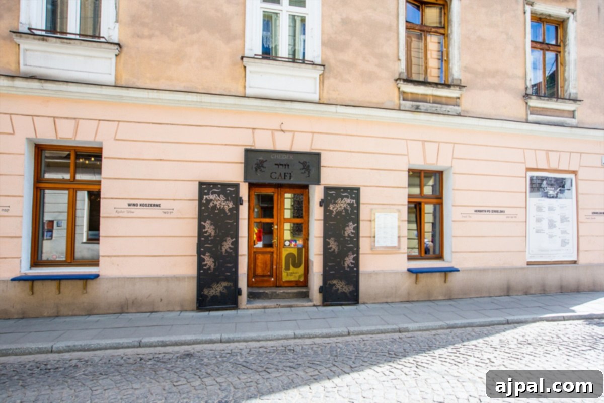 An architectural detail of a clock-adorned building in Kazimierz, Krakow’s Jewish District, reflecting its timeless charm.