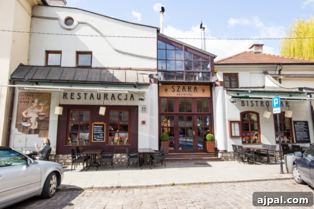 A charming cafe in Krakow's Jewish District, with a car parked outside, highlighting the lively street scene of Kazimierz.