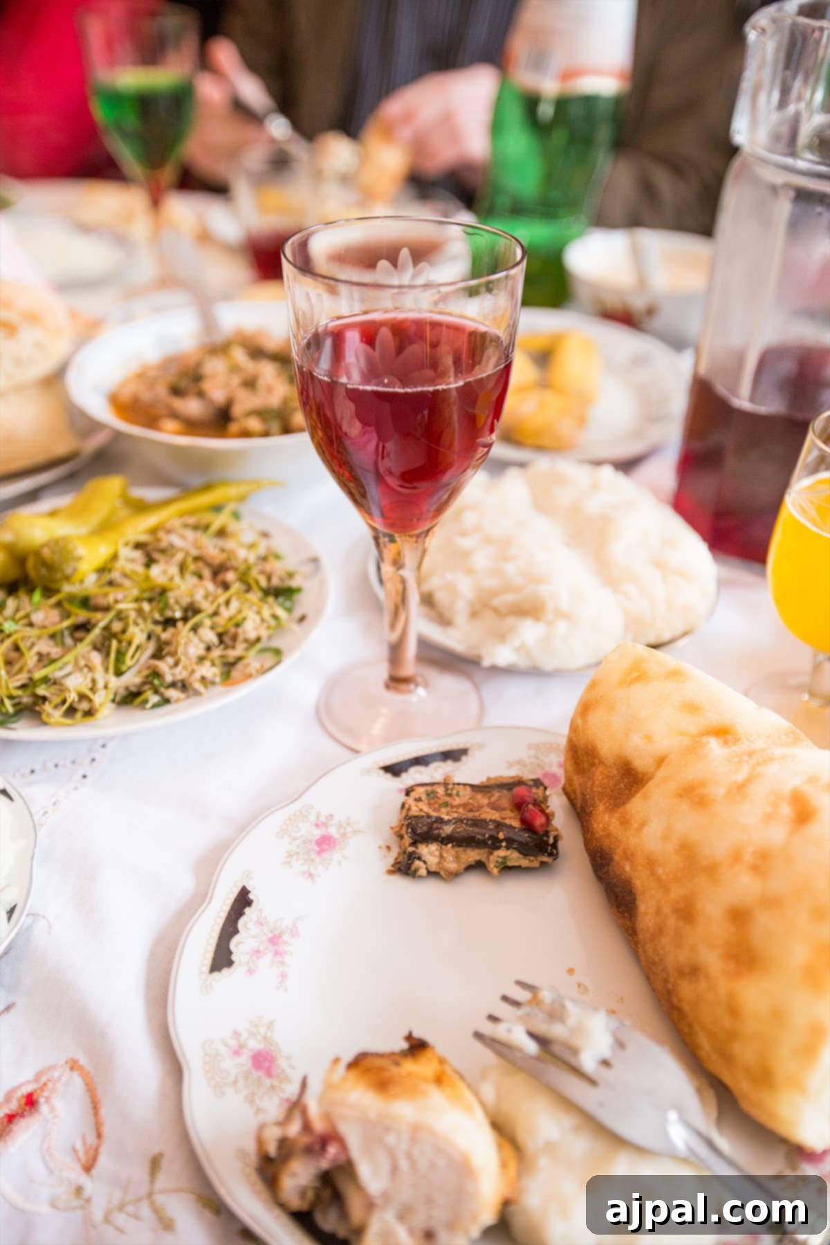 A table at a traditional Georgian Supra, overflowing with food and wine